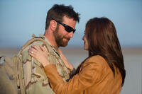 Bradley Cooper as Chris Kyle and Sienna Miller as Taya in "American Sniper."