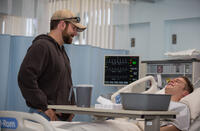 Bradley Cooper as Chris Kyle and Jake Mcdorman as Biggles in "American Sniper."