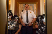 Kevin James as Paul Blart and Melissa Otero as Mini Kiss Dancer in "Paul Blart: Mall Cop 2."