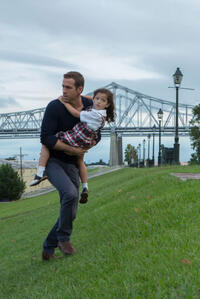 Ryan Reynolds as Young Damian and Jaynee-Lynne Kinchen as Anna in "Self/less."
