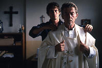 Joe Conner (Hugh Dancy) helps Christopher (John Hurt) prepare for one last communion in "Beyond the Gates."