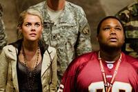 Rachael Taylor and Anthony Anderson in "Transformers."