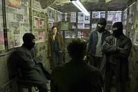 Julian (Julianne Moore) with her band of opperatives in "Children of Men."