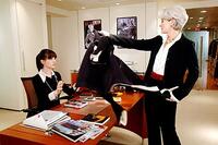 Fashion magazine editor Miranda Priestly (Meryl Streep) dumps her coat on Andy Sachs's (Anne Hathaway) desk in "The Devil Wears Prada."