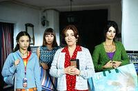 Yohana Cabo as Paula, Lola Duenas as Sole, Carmen Maura as Grandmother Irene, Penelope Cruz as Raimunda in "Volver."