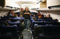 Writer/director/producer Paul Greengrass with the actors who portray the crew and passengers in "United 93."