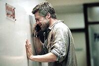 Richard (Brad Pitt) cries into the hospital phone as he speaks to his son in "Babel."