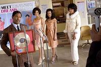 Manager Curtis (Jamie Foxx) presents a recording award to The Dreams in "Dreamgirls."
