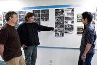 Art director Simon Murton, writer/director Kevin Munroe and environment and color design artist Steve Jung look at storyboards for "Teenage Mutant Ninja Turtles."