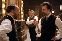 Paul Giamatti and Edward Norton in "The Illusionist."