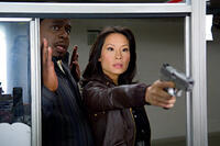 Cedric the Entertainer and Lucy Liu in "Code Name: The Cleaner."