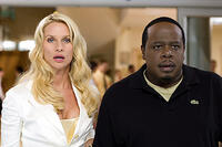 Nicollette Sheridan and Cedric the Entertainer in "Code Name: The Cleaner."
