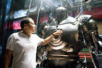 Director/Executive Producer Jon Favreau examines the Iron Monger armor on the set of “Iron Man.” 