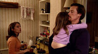 Cheryl (Amy Jo Johnson), Eben (Thomas Hildreth) and daughter share an intimate moment in "Islander."