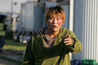 Kang-ho Song as Kang-du, who must rescue his abducted daughter in "The Host."
