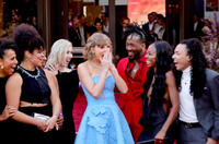
	Taylor Swift with dancers and band members
