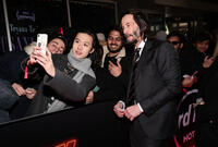 
	Keanu Reeves and fans
