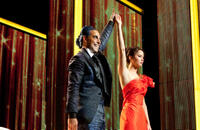 Caesar Flickerman (Stanley Tucci) and Katniss Everdeen (Jennifer Lawrence).
