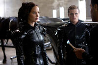 Katniss Everdeen (Jennifer Lawrence), Peeta Mellark (Josh Hutcherson) and Cinna (Lenny Kravitz).