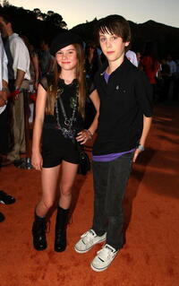 Madeline Carroll and Guest at the world premiere of "Wall-E."