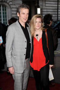 Peter Capaldi and guest at the gala premiere of "In The Loop."
