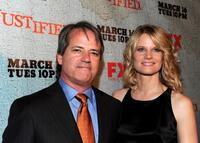 Graham Yost and Joelle Carter at the premiere of "Justified."