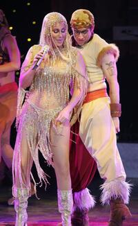Cher and her dancer perform on stage at Zenith.