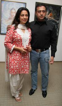Juhi Chawla and Gulshan Grover at the opening of an exhibition in Mumbai.