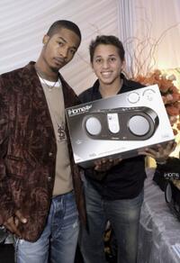 Chingy and Guest at the American Music Awards with distinctive assets.