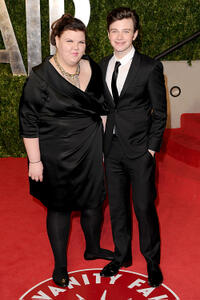 Ashley Fink and Chris Colfer at the 2011 Vanity Fair Oscar party in California.