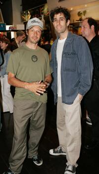 Tony Alva and Glen Friedman at the opening of "Lords Of Dogtown" Art Collection.
