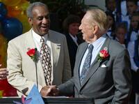 Bill Cosby and Art Linkletter at the podium as they were announced as the Grand Marshalls to lead the 2003 Rose Parade.