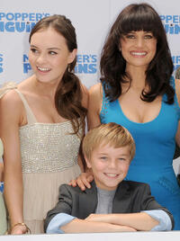 Madeline Carroll, Maxwell Perry Cotton and Carla Gugino at the premiere of "Mr. Popper's Penguins."