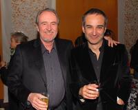 Wes Craven and Olivier Assayas at a cocktail reception before the Los Angeles premiere of "Paris, Je TAime", part of the 11th Annual City Of Lights, City Of Angeles French Film Festival.