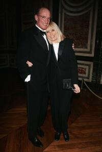 Mireille Darc poses with her husband at the international evening of the child event.