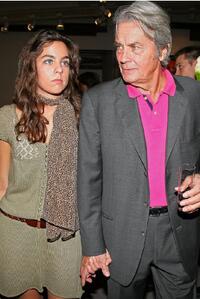 Alain Delon and his daughter Anouchka Delon at the pre-launch cocktail party for his upcoming auction of paintings.