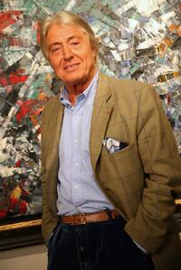 Alain Delon at cocktail party for his upcoming auction of paintings.