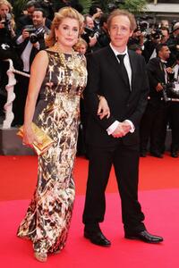 Catherine Deneuve and Director Arnaud Desplechin at the Palme d'Or Closing Ceremony during the 61st International Cannes Film Festival.