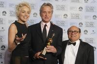 Danny Devito and Michael Douglas with Sharon Stone at the 61st Golden Globe awards.