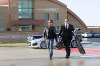Billionaire industrialist Tony Stark (Robert Downey Jr.) is attended to by his chauffeur Hogan (Jon Favreau) in “Iron Man.”