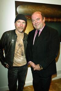 The Edge and Paul McGuinness at the opening of the new collection by artist Guggi.
