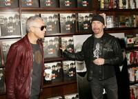 Adam Clayton and The Edge at the signing of the new book "U2 By U2."