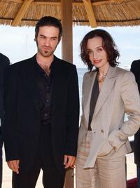 Romain Duris and Kristin Scott Thomas at the photocall of "Arsene Lupin" during the 56th Cannes Film Festival.