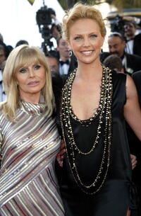 Britt Ekland and Charlize Theron at the screening of "The Life And Death Of Peter Sellers" during the 57th International Cannes Film Festival.
