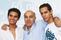 Mehdi Dehbi, Director Abdelkrim Bahloul and Ouassini Embarek at the photocall of "Le Soleil Assassine" during the 60th Venice Film Festival.