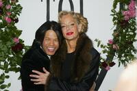 Farrah Fawcett and Zang Toi walk the runway at the Zang Toi Fall 2004 Fashion Show.