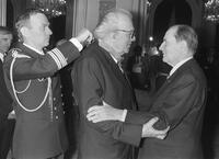 Federico Fellini receives the Honor Legion from French President Frantois Mitterrand.