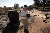 Mia Farrow at the burned village in Tamadjour.