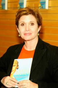 Carrie Fisher signs copies of her book The Best Awful.