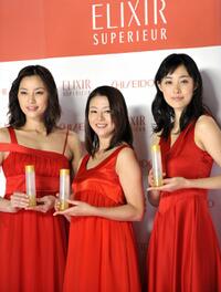 Asaka Seto, Kyoko Koizumi and Kazue Fukiishi at the display of the skin care and anti-aging product brand "Elixir Superieur."